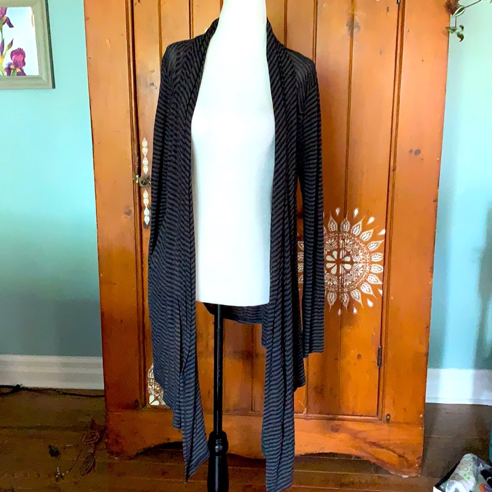 Semi-sheer soft asymmetrical cardigan/wrap.
